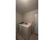 Laundry room with washer, dryer and ironing board at 7813 Arabian Pl, Orlando, FL 32818