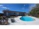 Backyard view of the pool with surrounding patio at 7813 Arabian Pl, Orlando, FL 32818