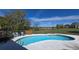 Backyard pool surrounded by deck and landscaping at 7813 Arabian Pl, Orlando, FL 32818