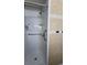 Updated walk-in shower with grab bar, shower curtain and tile surround at 7813 Arabian Pl, Orlando, FL 32818