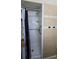 Updated walk-in shower with grab bar, shower curtain and tile surround at 7813 Arabian Pl, Orlando, FL 32818