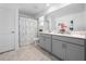 Bright bathroom features a dual sink vanity and shower with modern finishes at 9747 Petition Way, Orlando, FL 32832