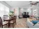 Bright dining area with a round table, chairs, and large windows providing ample natural light at 9747 Petition Way, Orlando, FL 32832