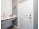 Functional entryway featuring a quartz counter, storage, and direct access to the home's interior at 9747 Petition Way, Orlando, FL 32832