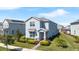Beautiful two-story home featuring a well-maintained lawn and lovely landscaping at 9747 Petition Way, Orlando, FL 32832