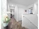 Bright hallway featuring neutral colors and seamless transition between spaces in the home's interior at 9747 Petition Way, Orlando, FL 32832