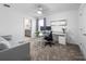 Contemporary home office with a sleek desk, comfortable seating, and bright lighting at 9747 Petition Way, Orlando, FL 32832
