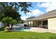 Backyard with patio, outdoor dining set, pool, and lounge chairs at 4847 Lake Milly Dr, Orlando, FL 32839