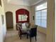 Bright dining area featuring a glass table, colorful chairs, and a buffet with artwork at 4847 Lake Milly Dr, Orlando, FL 32839