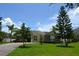 Inviting home with manicured lawn and mature trees enhancing curb appeal at 4847 Lake Milly Dr, Orlando, FL 32839