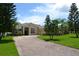 Attractive home with brick paved driveway, manicured lawn and beautifully landscaped front yard at 4847 Lake Milly Dr, Orlando, FL 32839