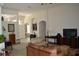 Spacious living room with tile flooring, neutral walls, and a view into the entryway of the home at 4847 Lake Milly Dr, Orlando, FL 32839