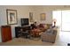 Bright living room with tile flooring and a glass sliding door to the outside at 4847 Lake Milly Dr, Orlando, FL 32839