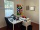 Bright office space with a large modern desk and a window providing natural light at 4847 Lake Milly Dr, Orlando, FL 32839