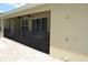 Outdoor patio area with an outdoor shower at 4847 Lake Milly Dr, Orlando, FL 32839