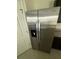Stainless steel Whirlpool refrigerator with a water and ice dispenser against the wall at 124 Sofia Ln, Lake Alfred, FL 33850