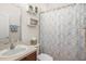 Clean bathroom with a vanity, toilet, and a shower at 12824 Penshurst Ln, Windermere, FL 34786