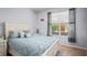 Comfortable bedroom with a large window offering natural light and a cozy bed at 12824 Penshurst Ln, Windermere, FL 34786