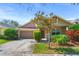 Charming single-Gathering home with a well-maintained lawn, mature landscaping, and a two-car garage at 12824 Penshurst Ln, Windermere, FL 34786