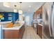 This well-lit kitchen features ample counter space, stainless appliances, and stylish fixtures at 12824 Penshurst Ln, Windermere, FL 34786