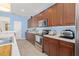 Modern kitchen with stainless appliances, granite countertops, and custom wood cabinets at 12824 Penshurst Ln, Windermere, FL 34786