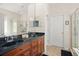Main bathroom features double sinks, walk-in shower, and tile flooring at 12824 Penshurst Ln, Windermere, FL 34786