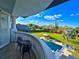 Balcony with seating overlooking the beautiful pool and large manicured backyard at 13305 Bellaria Cir, Windermere, FL 34786