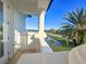 Balcony view of lush landscaping, tranquil lake, and blue skies at 13305 Bellaria Cir, Windermere, FL 34786