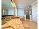 Large bathroom with granite countertops, double sinks, and a walk-in shower and soaking tub at 13305 Bellaria Cir, Windermere, FL 34786