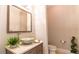 Chic powder room featuring a vessel sink, modern faucet, and stylish decor creating a sophisticated space at 13305 Bellaria Cir, Windermere, FL 34786