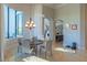 Elegant dining room with a chandelier, large windows, and access to the rest of the home at 13305 Bellaria Cir, Windermere, FL 34786
