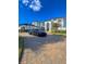 Attractive home with a paved driveway, arched windows and a black luxury car parked on the circular drive at 13305 Bellaria Cir, Windermere, FL 34786