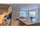 Gourmet kitchen with granite countertops, a center island, modern appliances, and open view into the living area at 13305 Bellaria Cir, Windermere, FL 34786