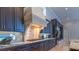 Close-up view of the kitchen showcasing custom cabinetry, a decorative range hood, and tile backsplash at 13305 Bellaria Cir, Windermere, FL 34786