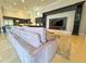Open living space with custom built-ins, a large television, and comfortable seating near the kitchen area at 13305 Bellaria Cir, Windermere, FL 34786