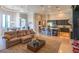 Open-concept living space featuring a gourmet kitchen, a cozy living area, and large windows showcasing outdoor views at 13305 Bellaria Cir, Windermere, FL 34786