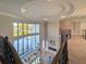 Spacious living room with high ceilings, comfortable seating, and a view of the pool at 13305 Bellaria Cir, Windermere, FL 34786