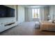 Bright primary bedroom with large windows, custom trim, and a serene color palette at 13305 Bellaria Cir, Windermere, FL 34786