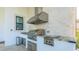 Stainless steel outdoor kitchen featuring premium grill and granite countertop at 13305 Bellaria Cir, Windermere, FL 34786