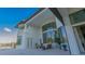 Grand patio with soaring windows, offering seamless indoor-outdoor living and serene lake views at 13305 Bellaria Cir, Windermere, FL 34786