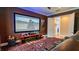 Home theater with comfortable seating, a large screen for an immersive viewing experience, and modern decor at 13305 Bellaria Cir, Windermere, FL 34786