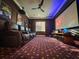 Home theater with comfortable seating, a large screen for an immersive viewing experience, and modern decor at 13305 Bellaria Cir, Windermere, FL 34786