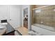 Well-lit bathroom with a tiled shower-tub combo and neutral color palette at 1375 Tuscana Ln # 1406, Davenport, FL 33896