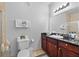 Bathroom with a large vanity, dark wood cabinets, and tile floors at 1375 Tuscana Ln # 1406, Davenport, FL 33896