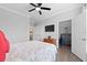 Well-lit bedroom with a ceiling fan, closet, and ample space at 1375 Tuscana Ln # 1406, Davenport, FL 33896