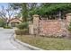 Community sign for Toscana Condominiums with manicured landscaping at 1375 Tuscana Ln # 1406, Davenport, FL 33896