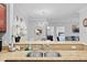 Granite countertop with stainless sink, with kitchen, dining, and living space beyond at 1375 Tuscana Ln # 1406, Davenport, FL 33896