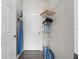 Bright walk-in closet features an organization system with shelves and rods for optimal storage at 1375 Tuscana Ln # 1406, Davenport, FL 33896