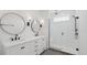 Bathroom featuring double sink vanity and glass enclosed shower with rainfall head at 15543 Gentle Rain Dr # 197, Winter Garden, FL 34787