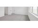 Bedroom featuring neutral walls and carpet and multiple windows at 15543 Gentle Rain Dr # 197, Winter Garden, FL 34787